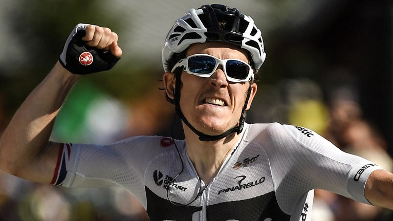 Geraint Thomas celebrates as he crosses the line after winning stage 11