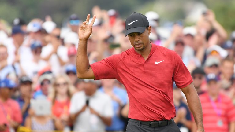 Tiger Woods held the outright lead at the turn before running into trouble at the 11th