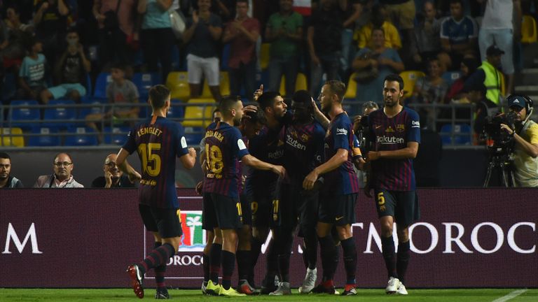 Dembele is mobbed by team-mates after putting Barcelona 2-1 ahead