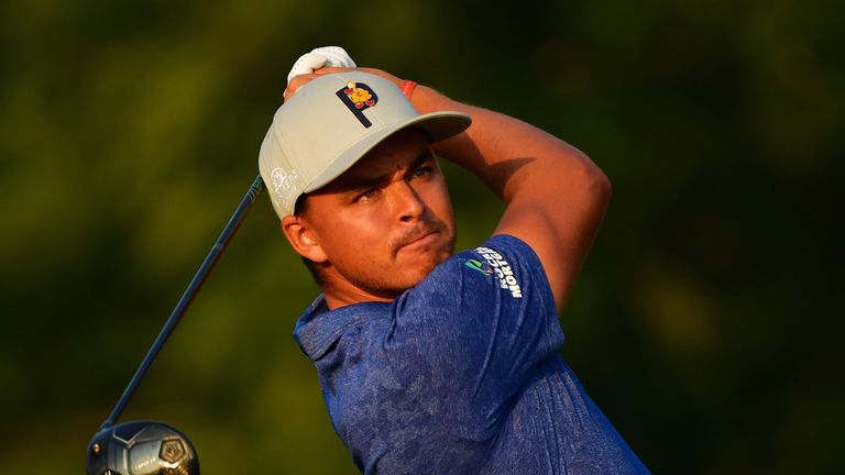 Rickie Fowler, chasing a first major triumph, sits two back at the midway stage