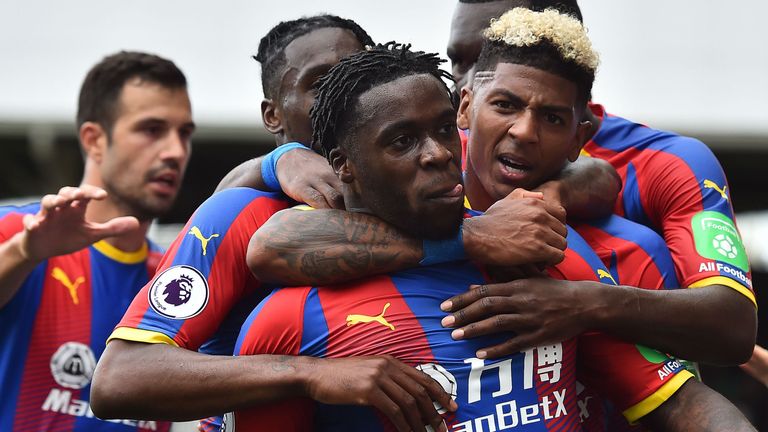 Jeffrey Schlupp is mobbed after bagging Palace's opener