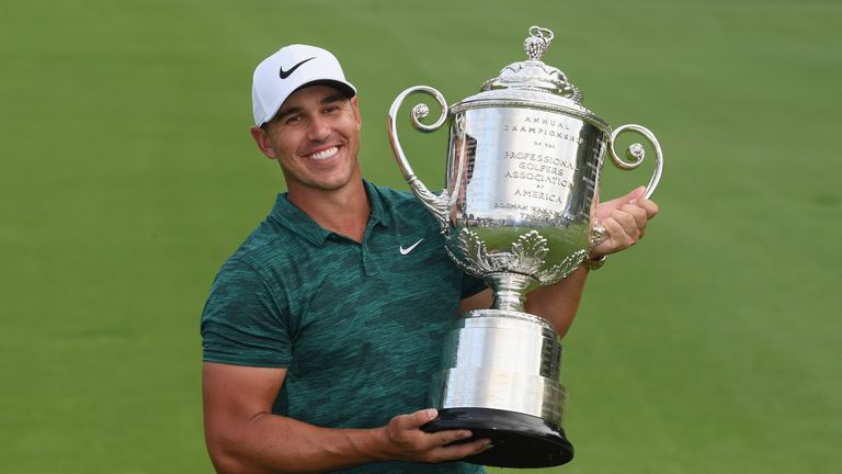 Koepka hoists the Wanamaker Trophy last year