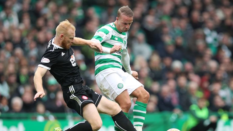Leigh Griffiths (R) battles for the ball with Ziggy Gordon