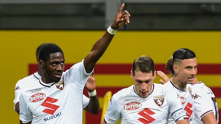 Ola Aina (L) celebrates Torino's equaliser