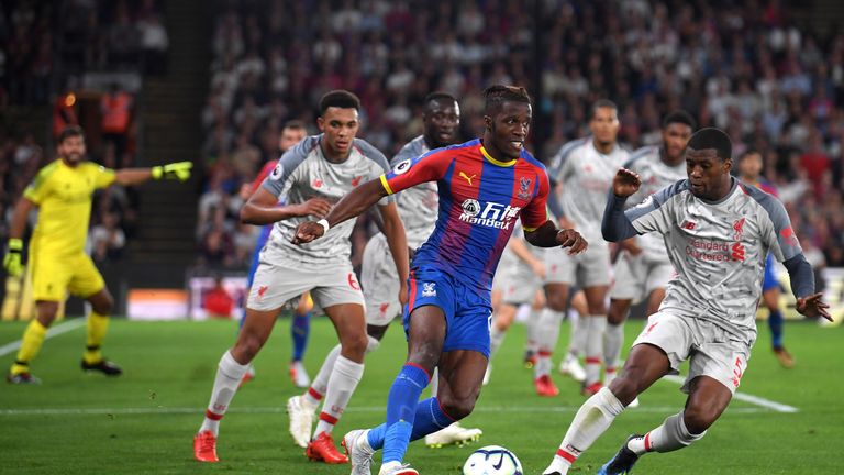 Wilfried Zaha tries to get away from defenders at Selhurst Park