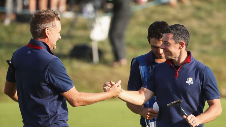 Ian Poulter and Rory McIlroy celebrate winning their Ryder Cup fourballs match