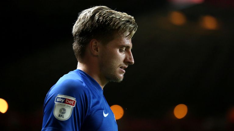 Peterborough say they will support striker Jason Cummings