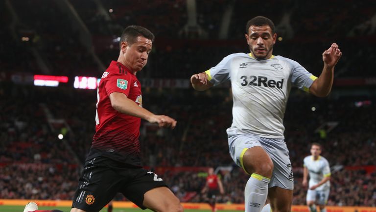Ander Herrera is challenged by Mason Bennett