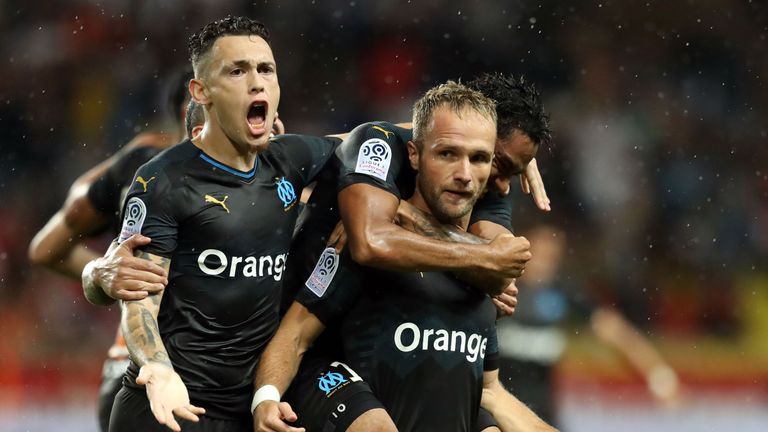 Valere Germain (right) celebrates his winner for Marseille