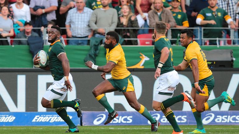 Siya Kolisi makes a break down the right touchline with Marika Koroibete in pursuit