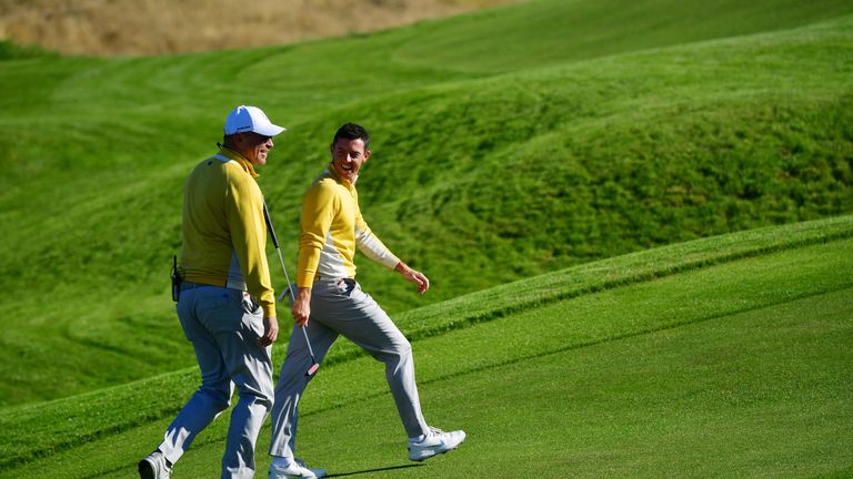 Thomas Bjorn and Rory McIlroy chat during Thursday's practice round