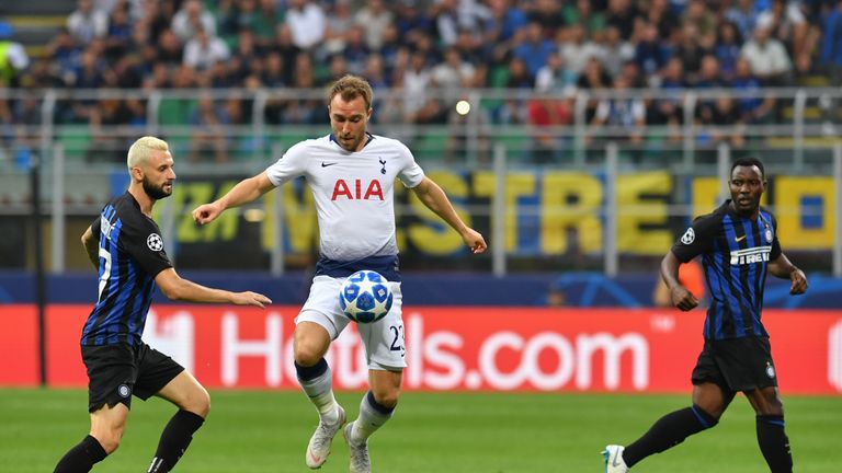 Christian Eriksen controls the ball under pressure from Marcelo Brozovic