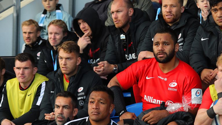 Billy and Mako Vunipola look on after both leaving the field with injuries during the match