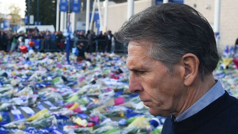 Leicester manager Claude Puel observes the tributes and messages to Leicester owner Vichai Srivaddhanaprabha