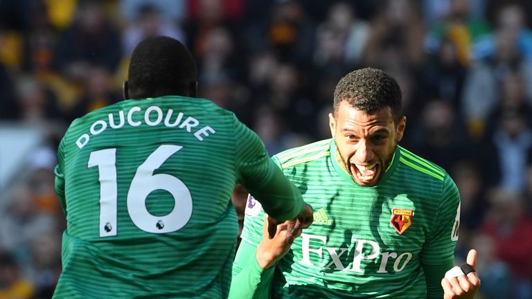 Etienne Capoue celebrates with Abdoulaye Doucoure after scoring his team's first goal