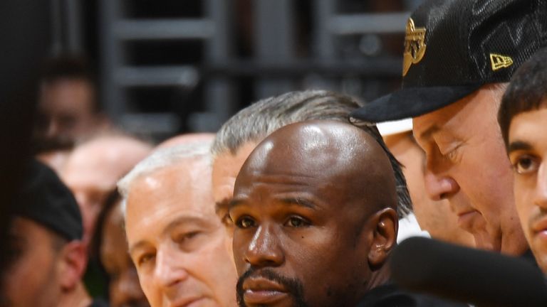 Floyd Mayweather was among the celebrities at courtside for LeBron's Staples Center debut