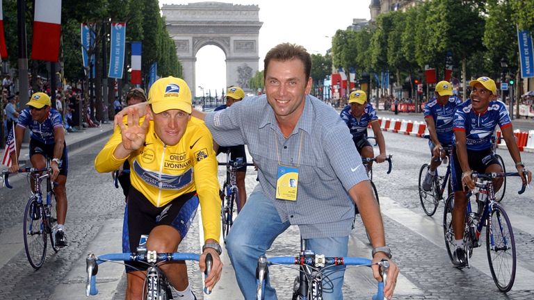 Lance Armstrong's former manager Johan Bruyneel (R) has been banned from cycling for life
