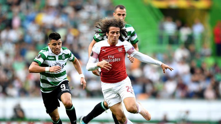 Marcos Acuna and Matteo Guendouzi chase the ball in the first half