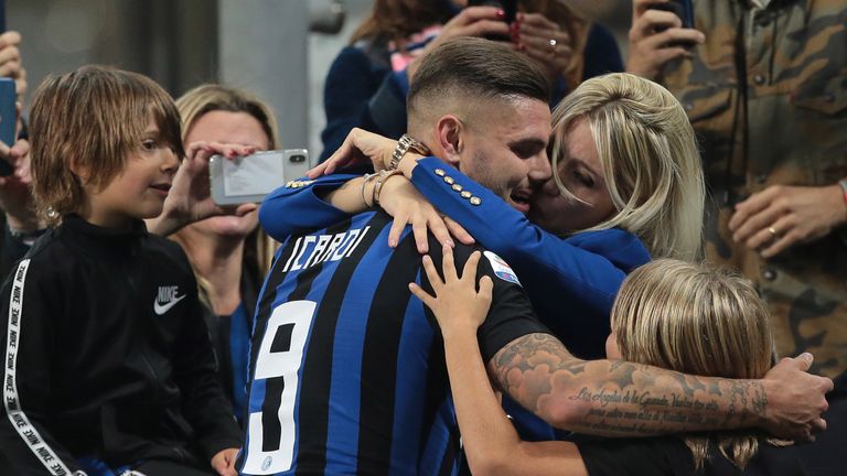 Mauro Icardi embraces his wife Wanda Nara after the late victory