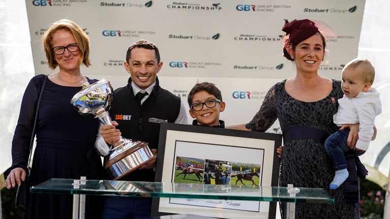 Silvestre De Sousa with his Stobart Champion Jockey Trophy at Ascot Racecourse