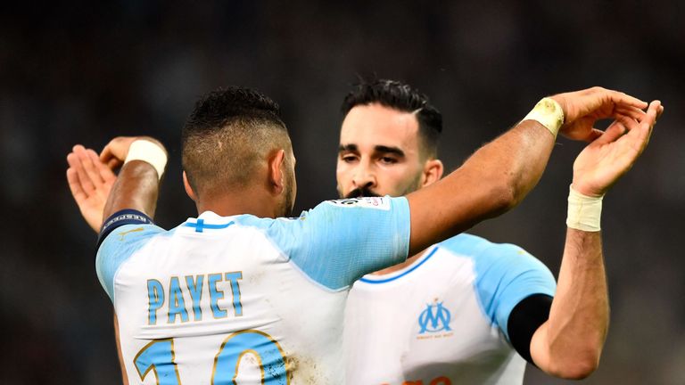 Adil Rami celebrates with Dimitri Payet