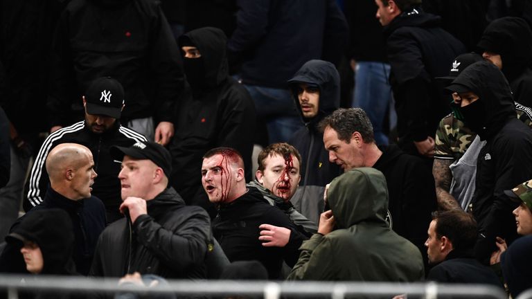 Bleeding Ajax supporters react after clashes with Greek riot police