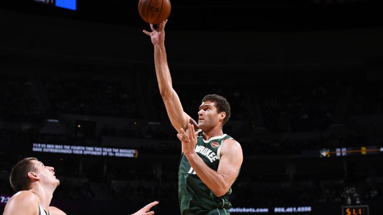Brook Lopez fires a jump hook against the Denver Nuggets