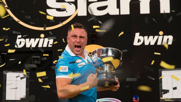 Price celebrates with the Grand Slam of Darts trophy
