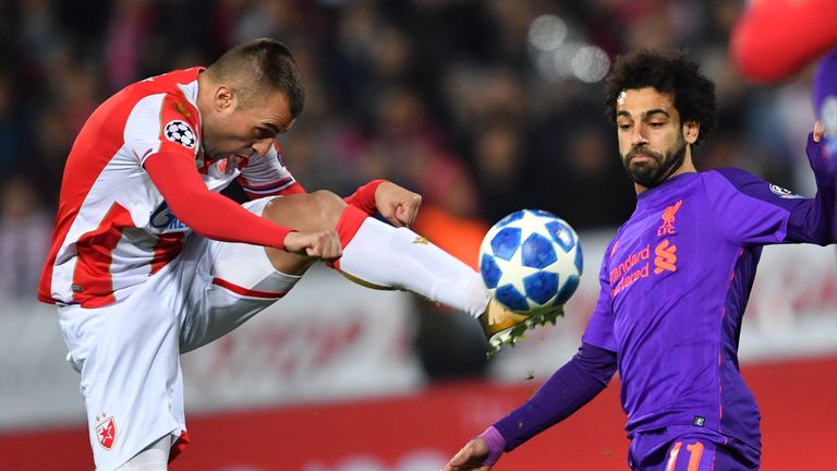 Nenad Krsticic (L) vies for the ball with Liverpool forward Mohamed Salah