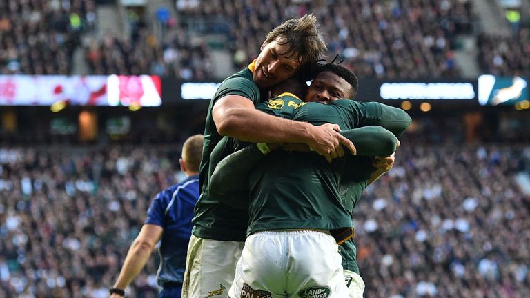 The Springboks celebrate after Nkosi's try