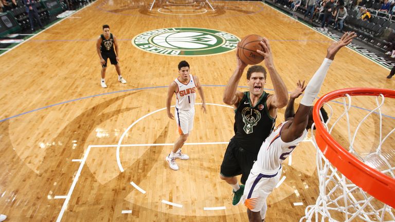 Lopez attacks the basket against the Phoenix Suns