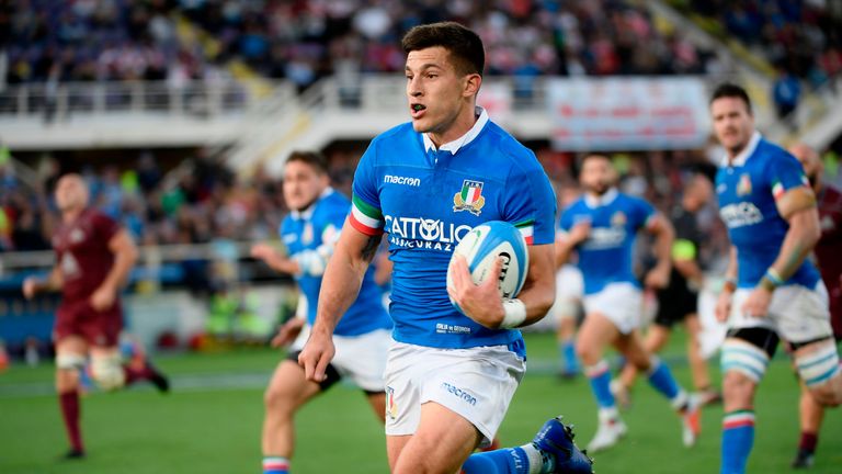 Italy's Tommaso Allan races away to score a try against Georgia