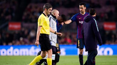 Image of Sergio Busquets comforts Malcom when coming off injured for Barcelona against Cultural Leonesa