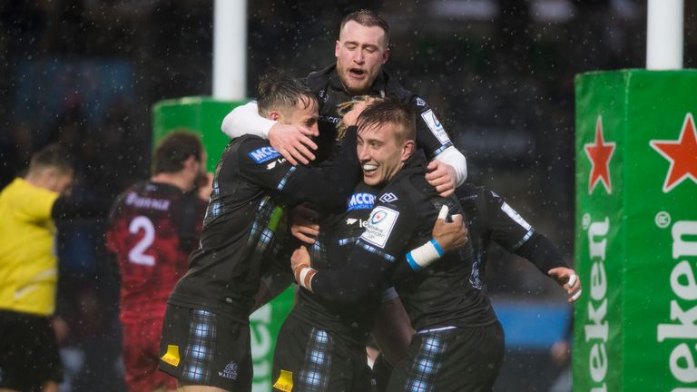 The Warriors celebrate Niko Matawalu's try against Lyon