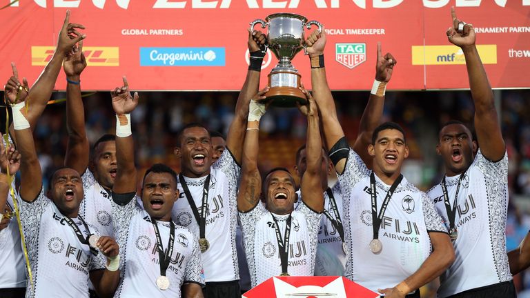 Fiji players celebrate with the trophy after winning the cup final in Hamilton on Sunday
