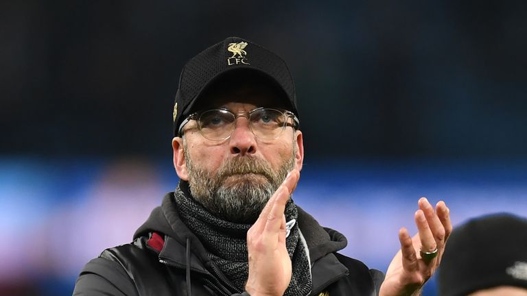 Jurgen Klopp applauds Liverpool fans after his side's 2-1 loss to Manchester City