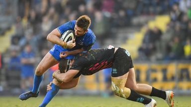 Ross Byrne of Leinster is tackled by Giovanni Licata of Zebre 