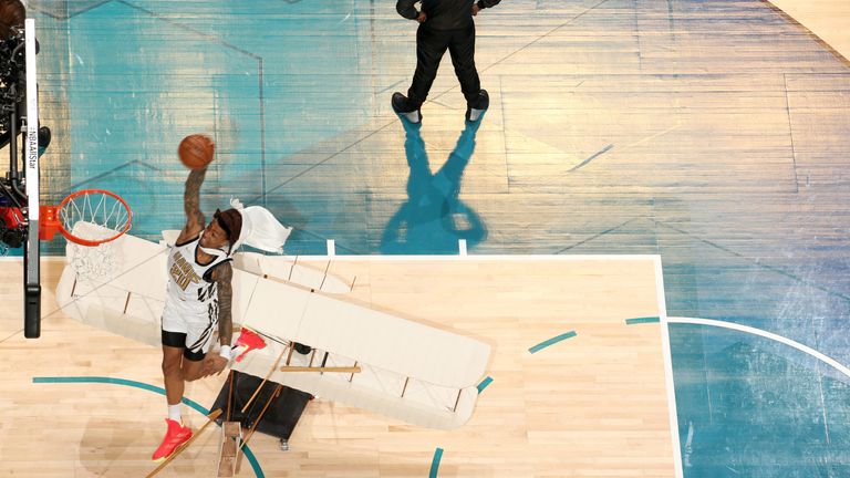 John Collins dunks over a replica aeroplane in the All-Star Dunk Contest