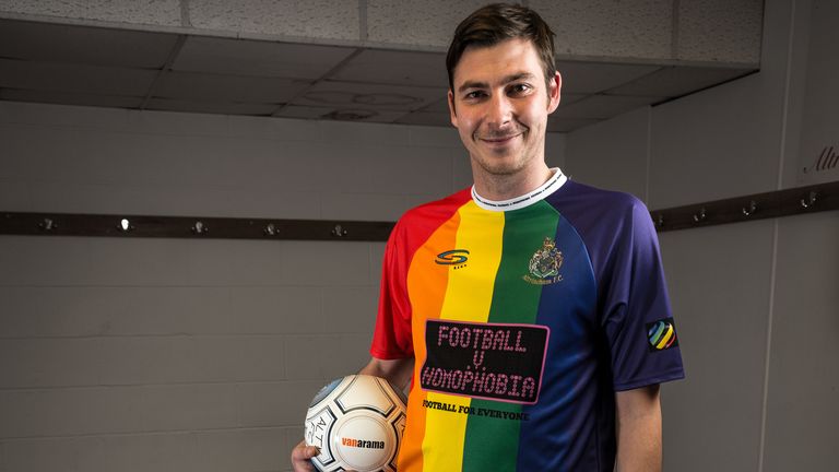 Altrincham defender Harrison proudly shows the special shirt