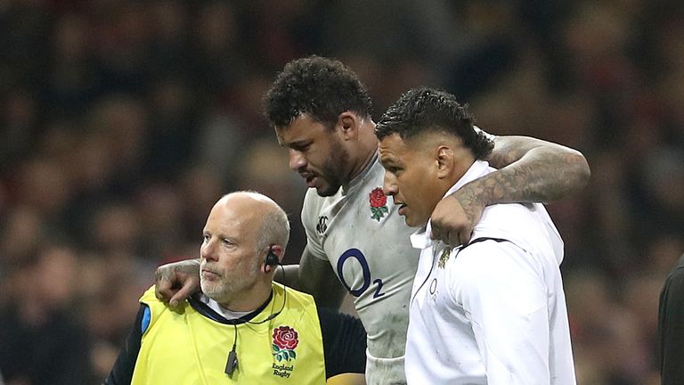 Courtney Lawes leaves the field injured during England's defeat to Wales 