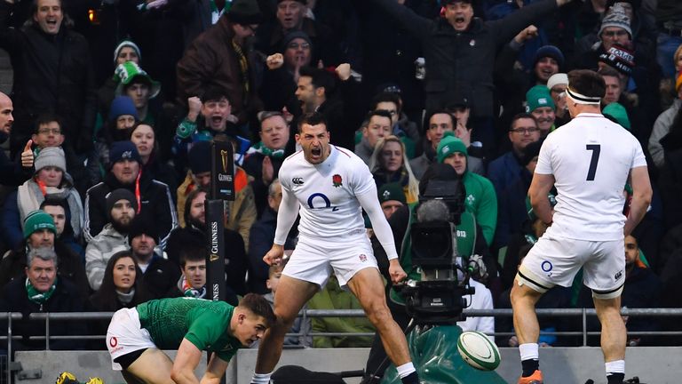 Jonny May celebrates after his opening score in the corner inside two minutes