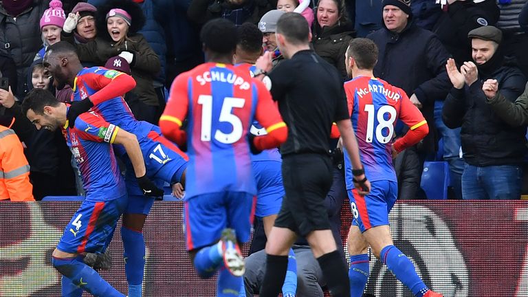 Luka Milivojevic celebrates with his teammates after scoring first goal