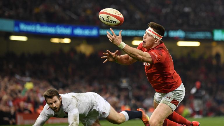Wales' Josh Adams catches the ball before diving over to score against England in Cardiff