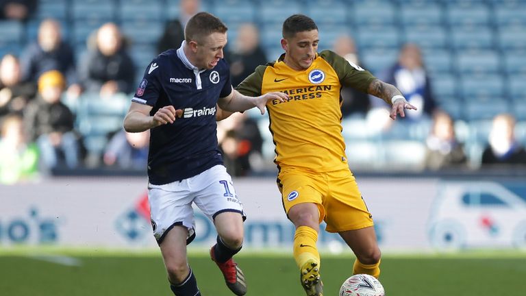 Shane Ferguson (L) battles for possession with Brighton midfielder Anthony Knockaert