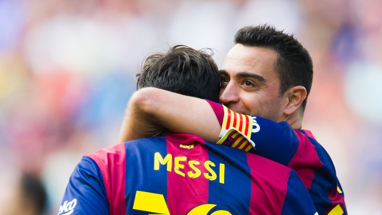 Lionel Messi and Xavi celebrate whilst playing alongside each other at Barcelona