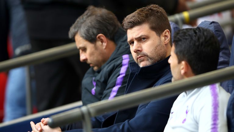 Pochettino sits in the dugout at Wembley ahead of the north London derby