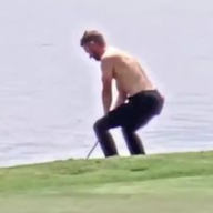 Kevin Dougherty makes hole-out eagle from the water with no shirt or shoes on 