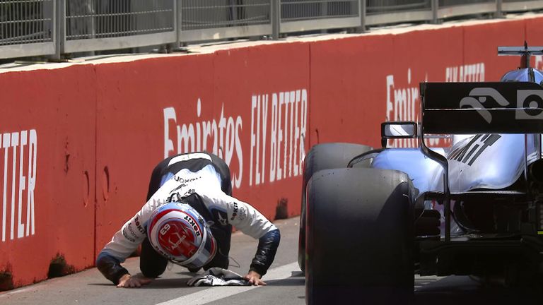 George Russell runs over a loose drain cover during Azerbaijan GP Practice One, with the session then being abandoned