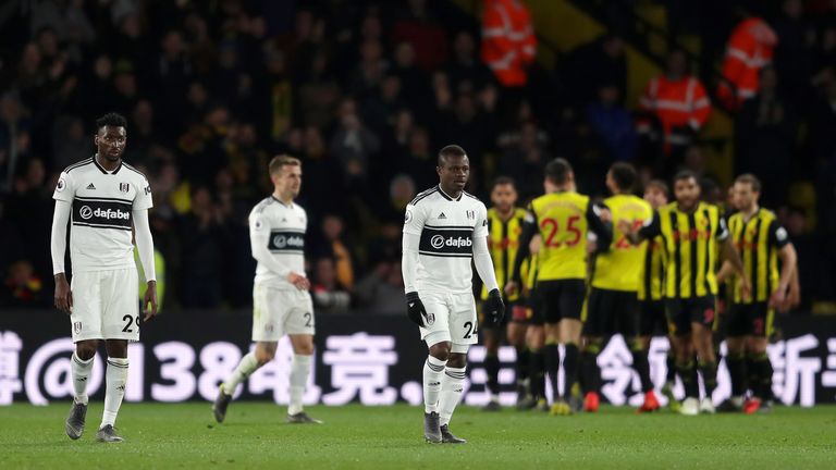 Andre Zambo Anguissa and Jean Michael Seri of Fulham look down on