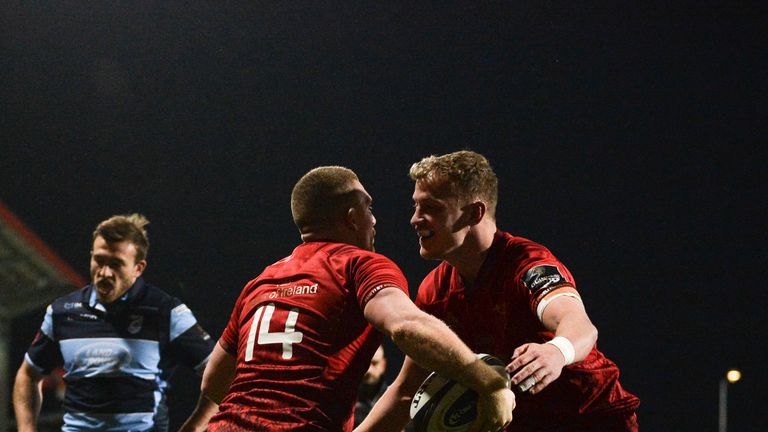 Andrew Conway celebrates with team-mate Mike Haley after scoring Munster's fifth try